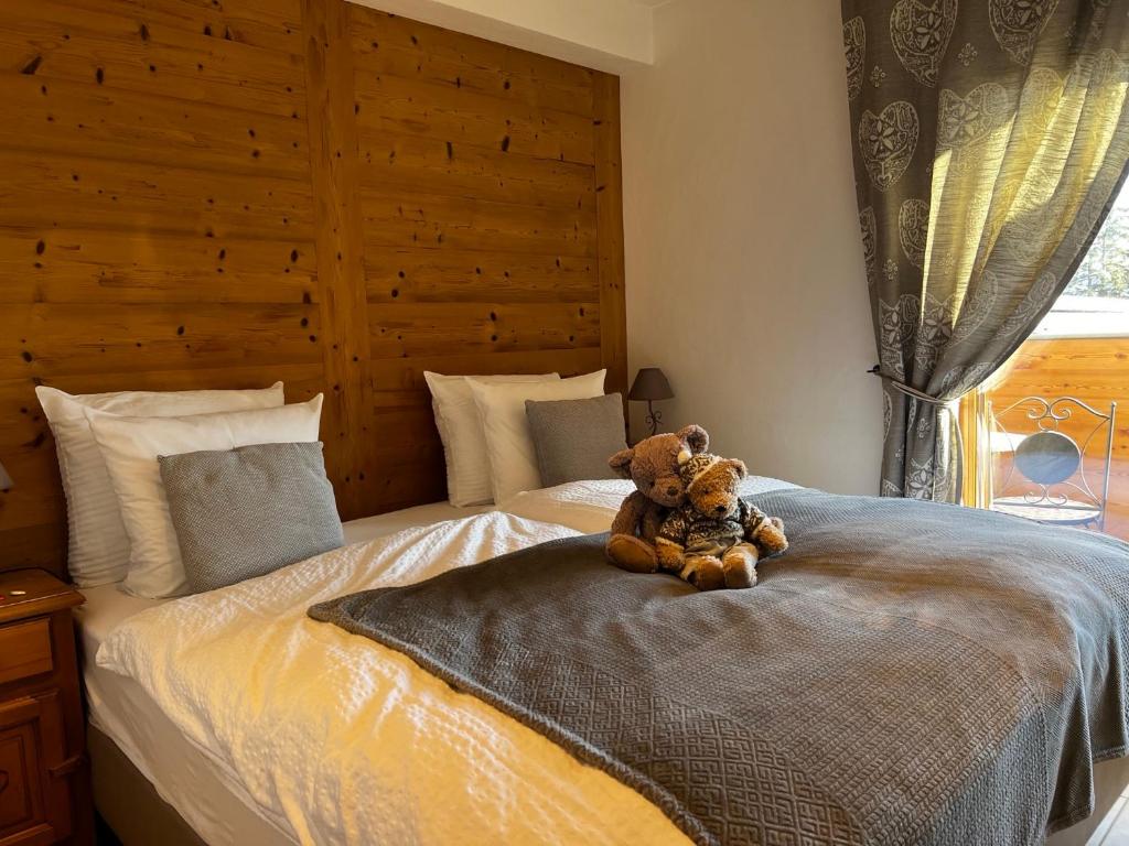 Letto o letti in una camera di Hôtel de charme la Poste