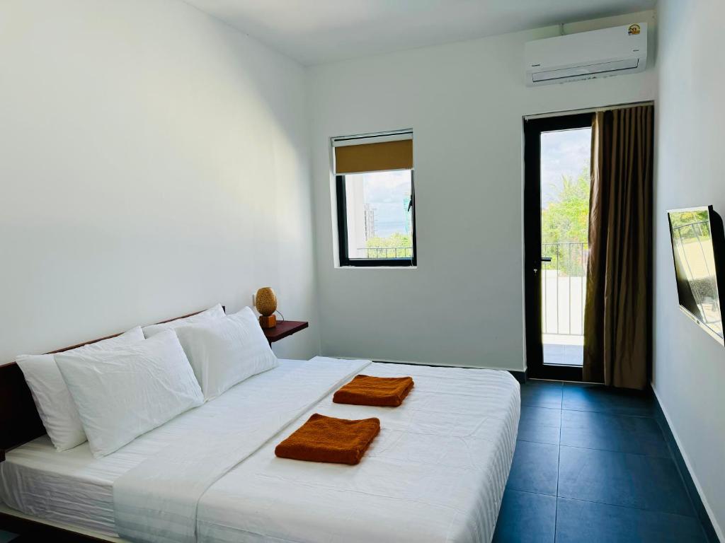 Postel nebo postele na pokoji v ubytování Onederz Kampot