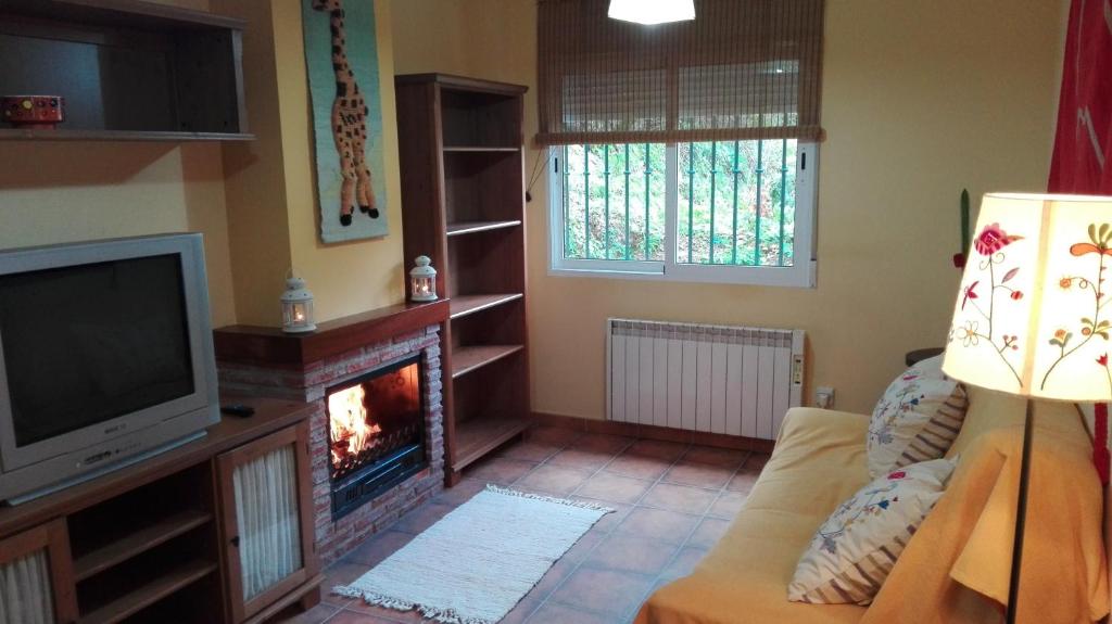Televízia a/alebo spoločenská miestnosť v ubytovaní Vivienda Chorrillos del Lavadero