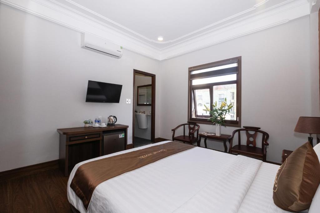 Postel nebo postele na pokoji v ubytování Jade Hotel