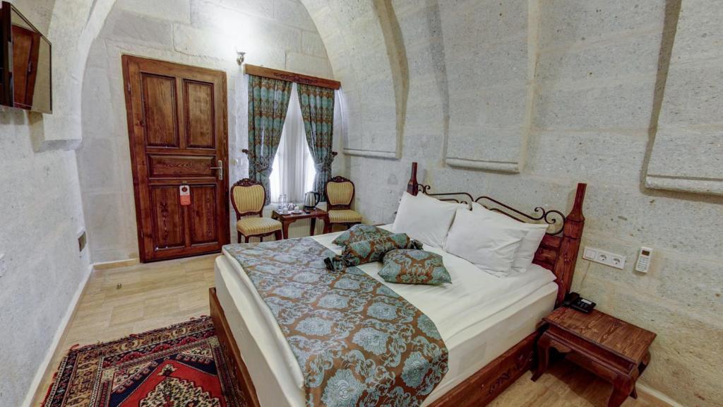 Postel nebo postele na pokoji v ubytování Hikmet's House