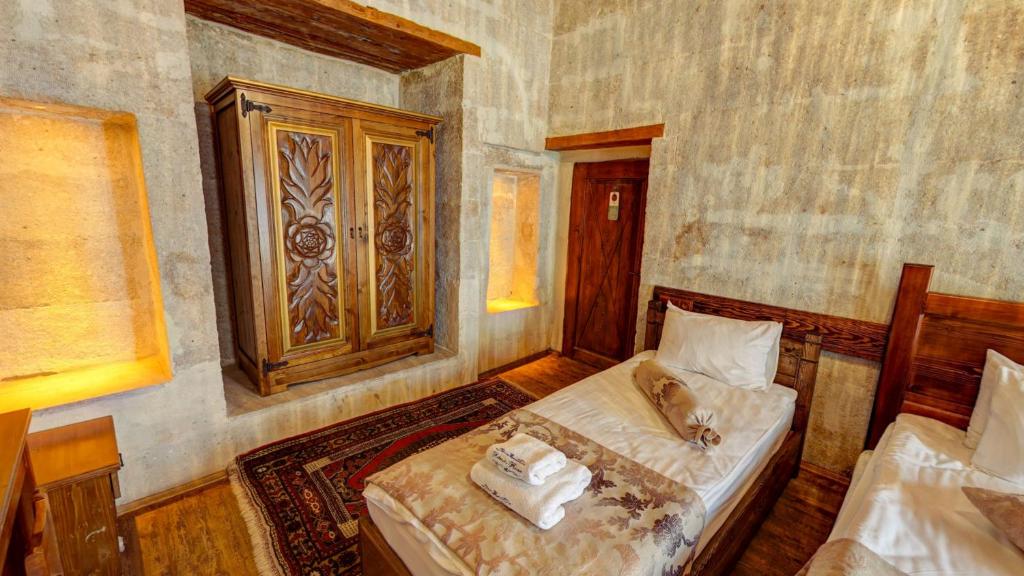 Postel nebo postele na pokoji v ubytování Hikmet's House
