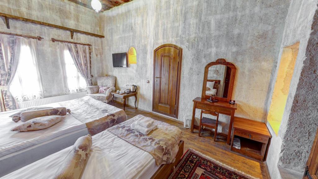 Postel nebo postele na pokoji v ubytování Hikmet's House