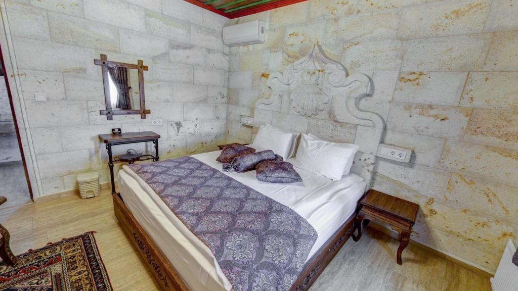 Postel nebo postele na pokoji v ubytování Hikmet's House