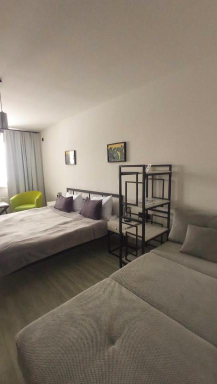 Postel nebo postele na pokoji v ubytování LOFT HOUSE