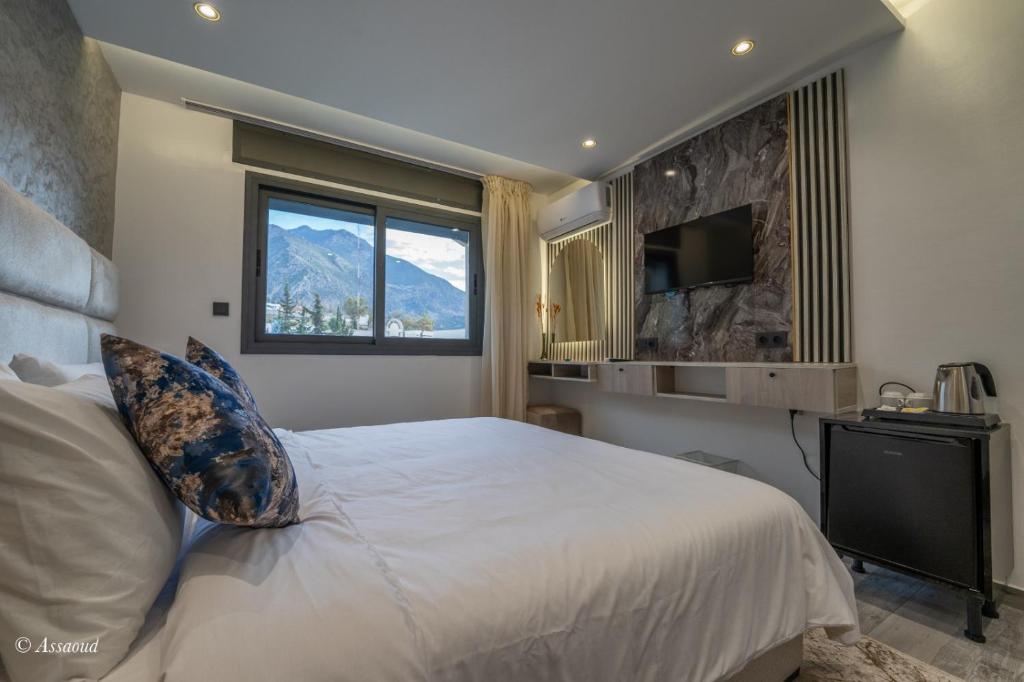 Postel nebo postele na pokoji v ubytování Luxury Chaouen