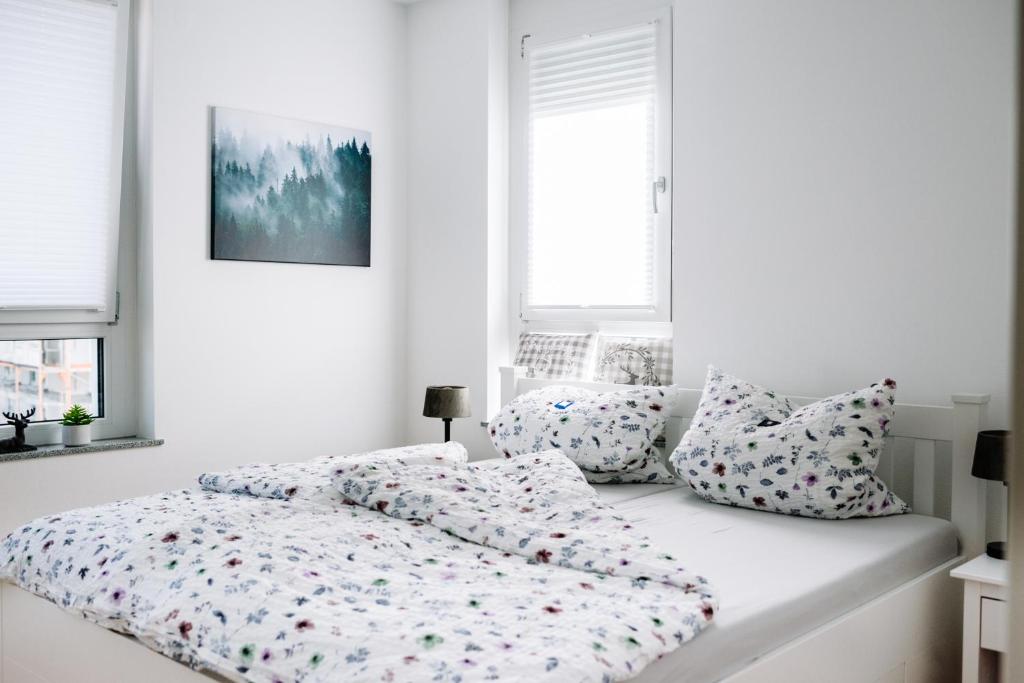 Ένα ή περισσότερα κρεβάτια σε δωμάτιο στο Schwarzwald Apartment mit Balkon-Garage-Aufzug