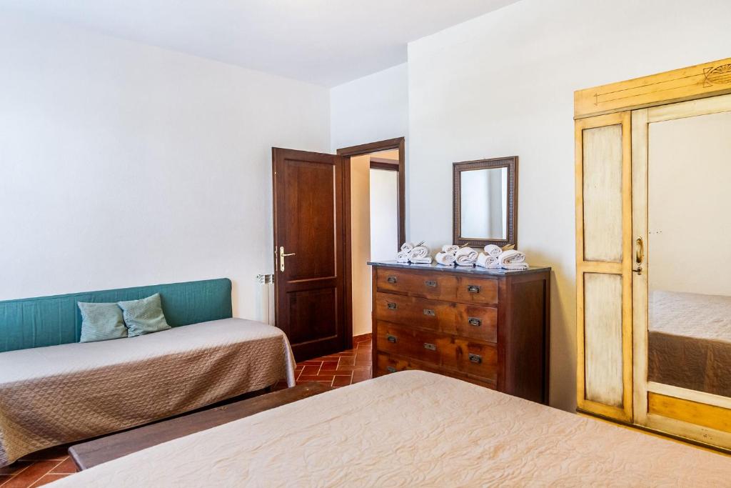 A bed or beds in a room at Country House Bel Giardino