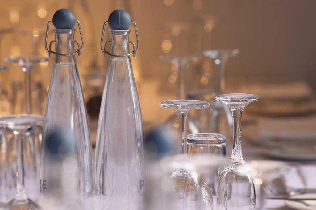 a group of glass bottles sitting on top of a table at Stamford Bridge Hotel London in London