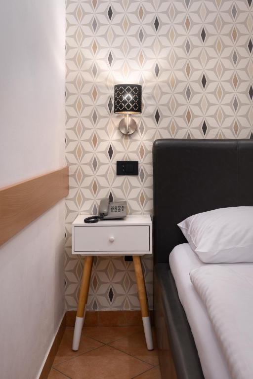 Postelja oz. postelje v sobi nastanitve Ljubljana Resort Hotel & Camping