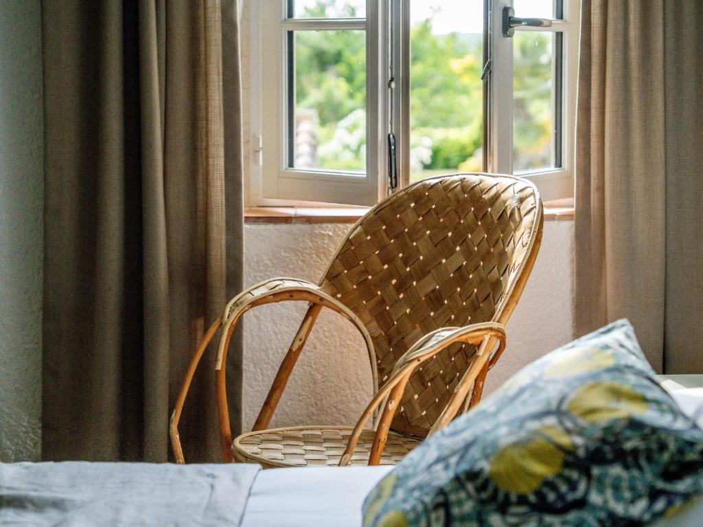 Postel nebo postele na pokoji v ubytování Logis Hôtel La Ferme de Flaran