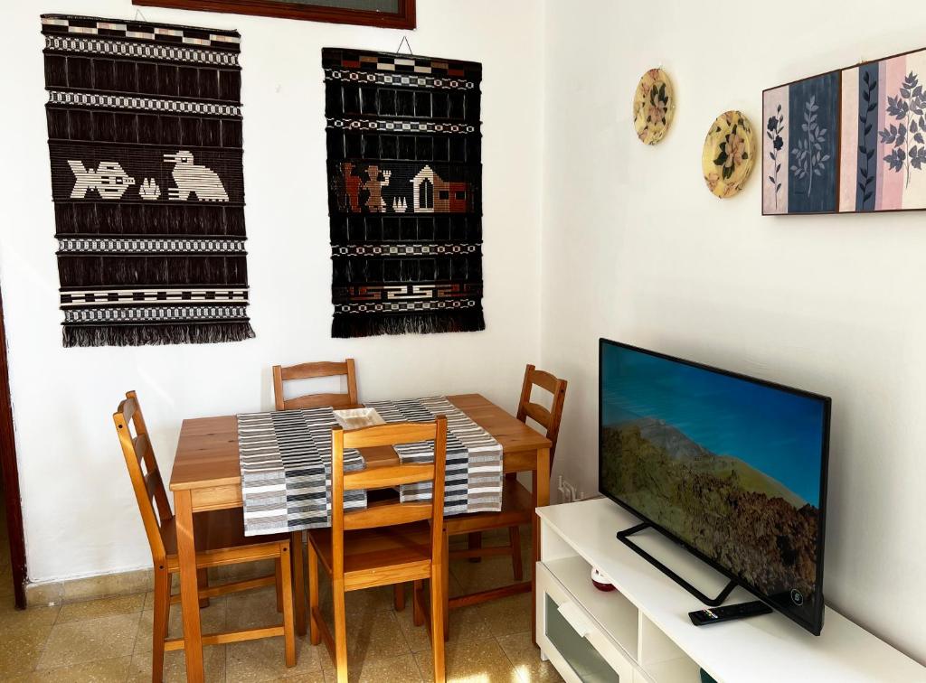 TV a/nebo společenská místnost v ubytování Casa PALMAROSA