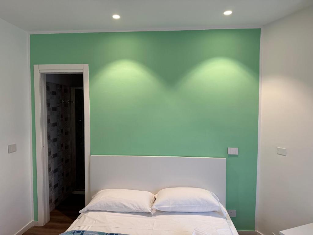 A bed or beds in a room at La Vecchia Stazione B&B