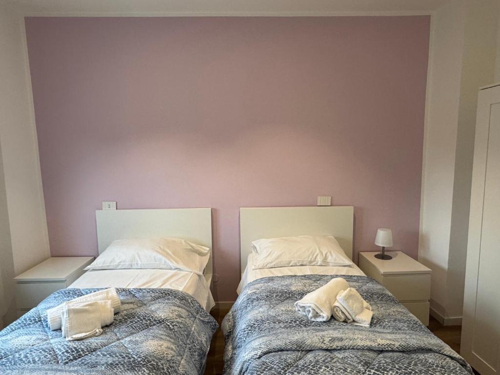 A bed or beds in a room at La Vecchia Stazione B&B