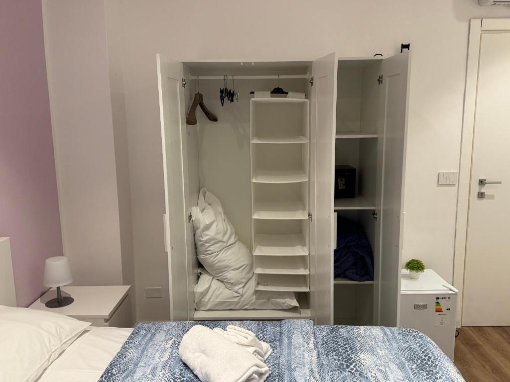 A bed or beds in a room at La Vecchia Stazione B&B
