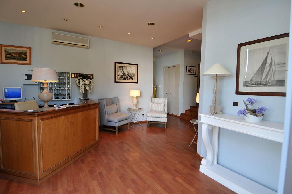 an office with a desk and chairs in a room at Hotel Santa Maria in Saint-Florent