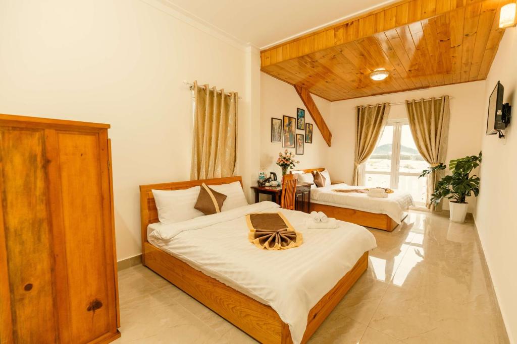 Postel nebo postele na pokoji v ubytování Lê Mùi Hotel - Apartment