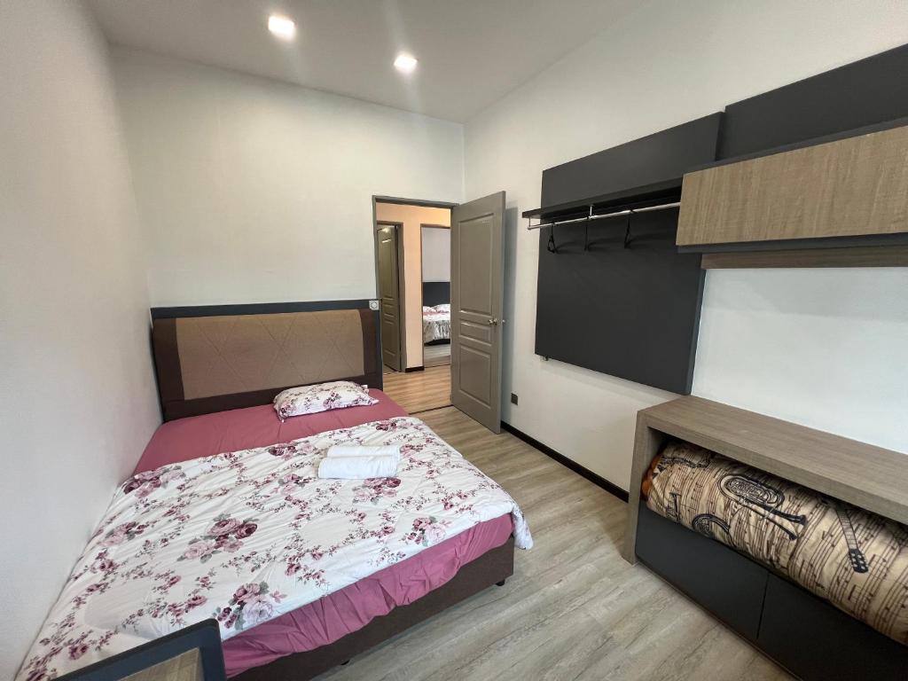 Postel nebo postele na pokoji v ubytování DanteQuintet Cameron Highlands
