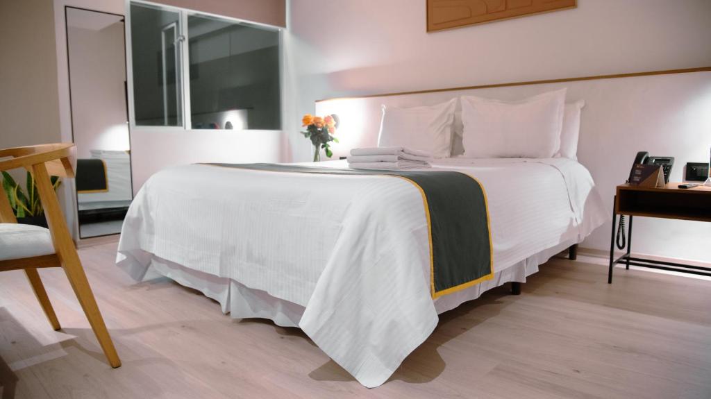 Postel nebo postele na pokoji v ubytování Hotel Finlandia
