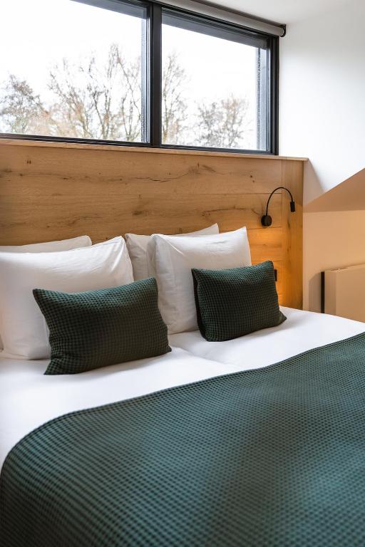Postel nebo postele na pokoji v ubytování Hoeve BuytenHout