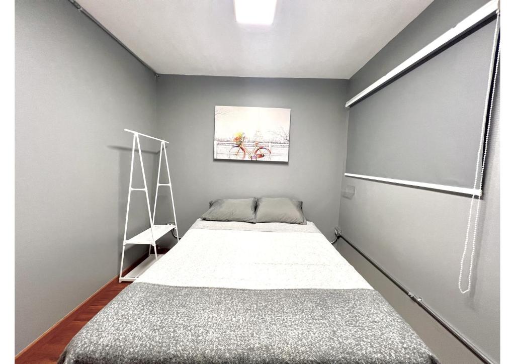 Voodi või voodid majutusasutuse Hostel La Moneda toas