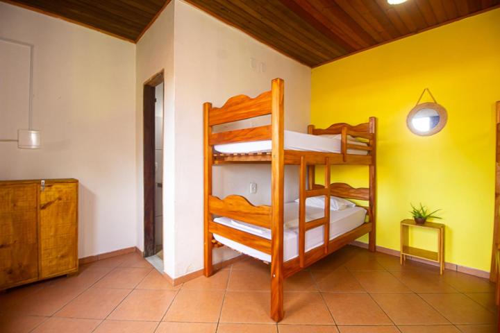 Postel nebo postele na pokoji v ubytování Guava Hostel Serra Grande