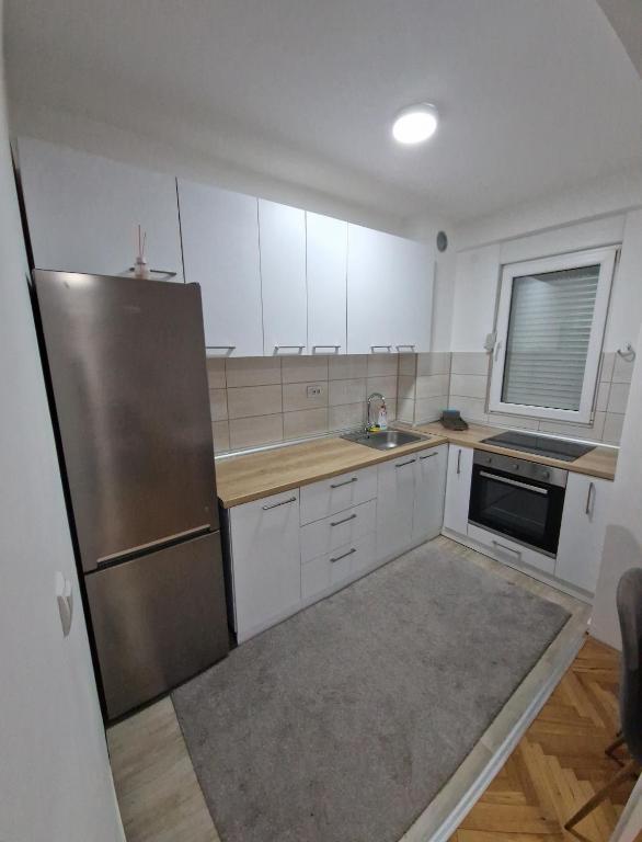 Kuchyň nebo kuchyňský kout v ubytování Apartman DRINA