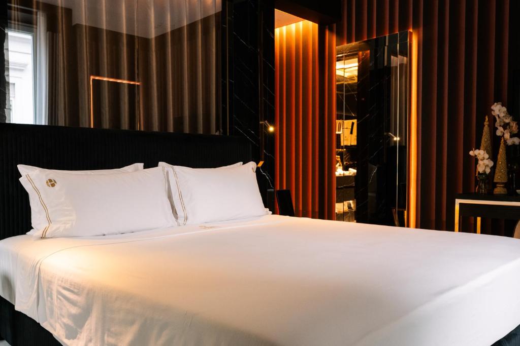 Postel nebo postele na pokoji v ubytování Bra Hotel
