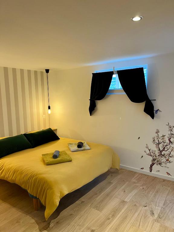 Postel nebo postele na pokoji v ubytování Le Studio