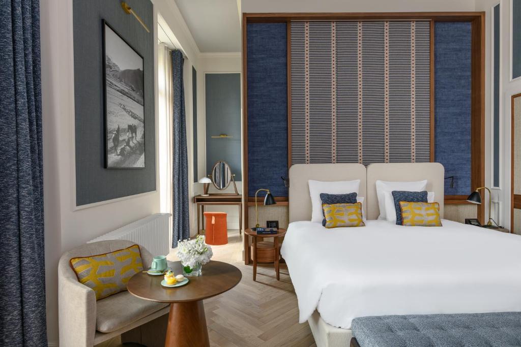 Rúm í herbergi á Hôtel Métropole Genève