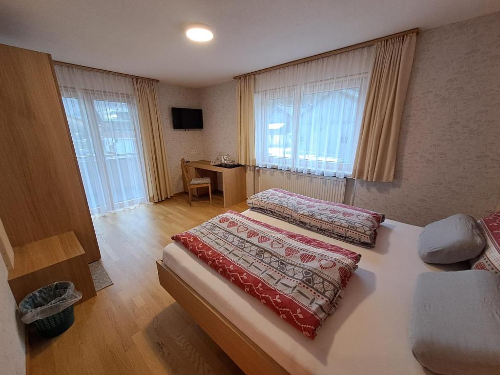 Postel nebo postele na pokoji v ubytování Gästehaus Manuela Puchmayr
