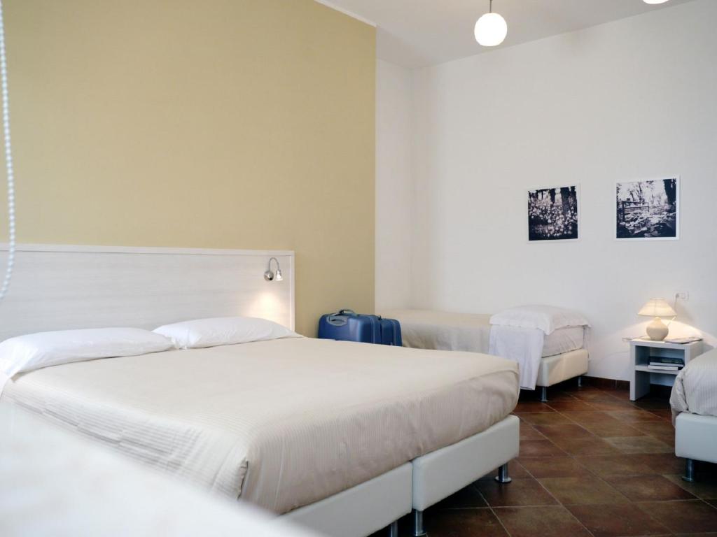 Postel nebo postele na pokoji v ubytování Tenute D'Onghia