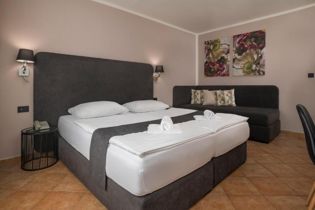 Postelja oz. postelje v sobi nastanitve Ljubljana Resort Hotel & Camping