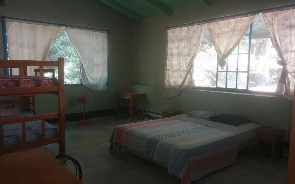 Postel nebo postele na pokoji v ubytování Juan Lindo Hostel