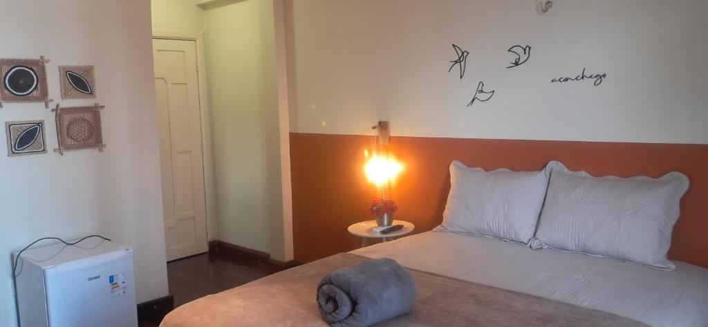 Postel nebo postele na pokoji v ubytování Casa Rosa Suítes 5 min de caminhada da PRAIA DA PONTA NGRA