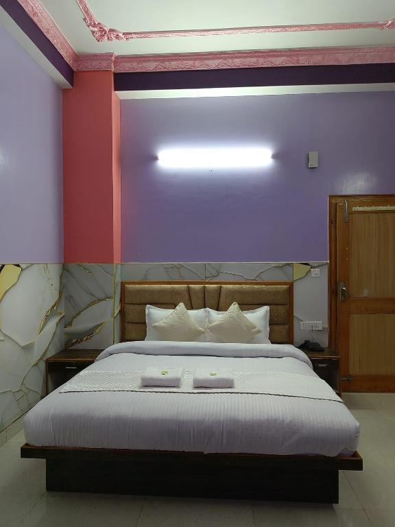 Postel nebo postele na pokoji v ubytování Hotel Ashoka B&B