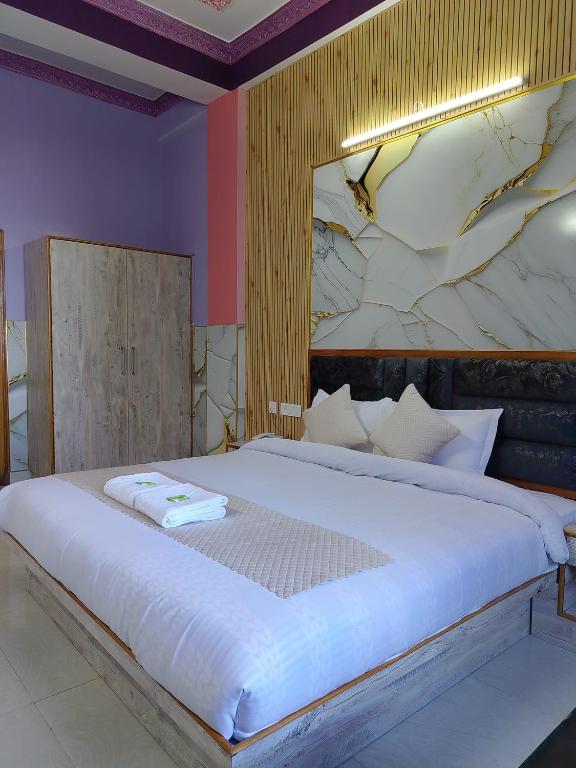 Postel nebo postele na pokoji v ubytování Hotel Ashoka B&B