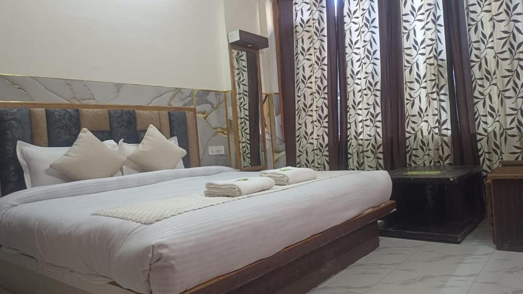 Postel nebo postele na pokoji v ubytování Hotel Ashoka B&B