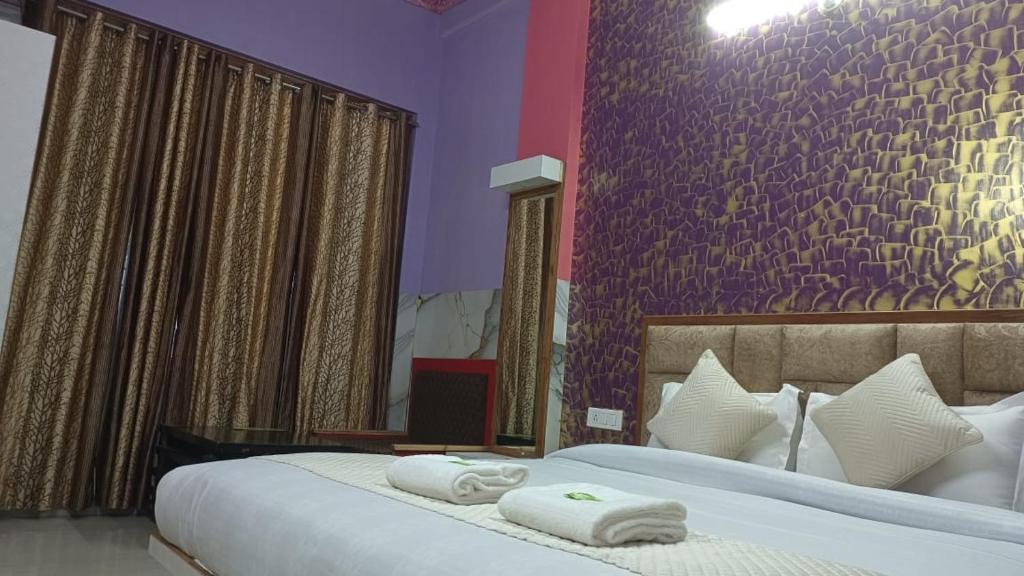 Postel nebo postele na pokoji v ubytování Hotel Ashoka B&B
