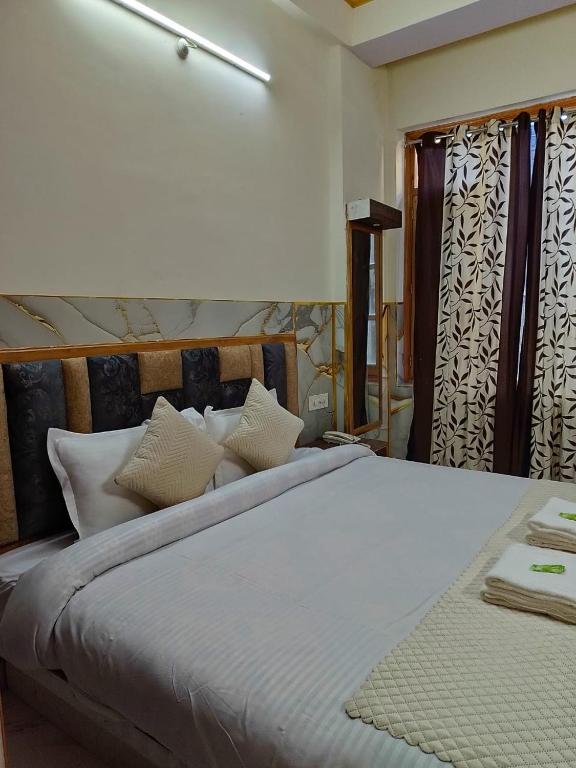 Postel nebo postele na pokoji v ubytování Hotel Ashoka B&B