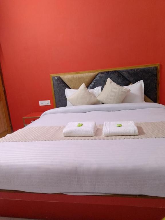 Postel nebo postele na pokoji v ubytování Hotel Ashoka B&B