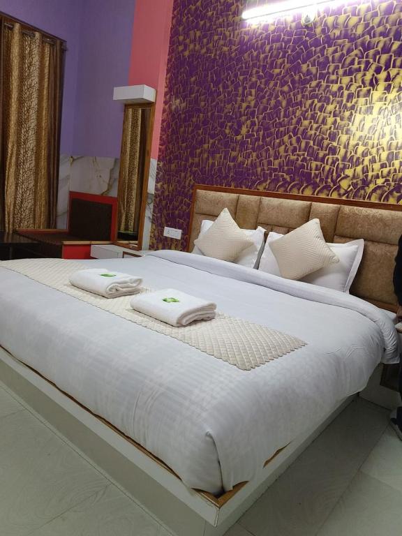Postel nebo postele na pokoji v ubytování Hotel Ashoka B&B
