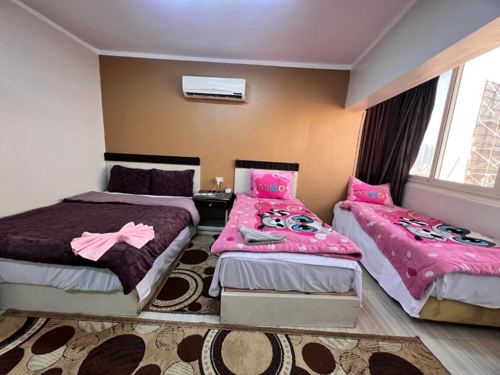 Postel nebo postele na pokoji v ubytování Isis Hostel 2
