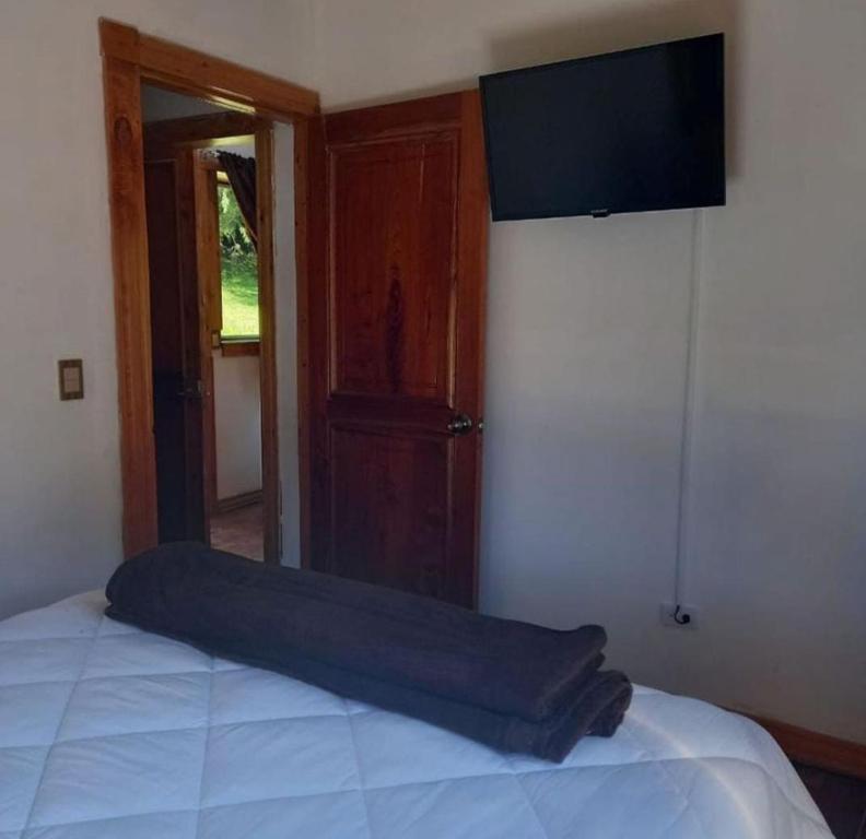 Postel nebo postele na pokoji v ubytování Cabañas La Laguna