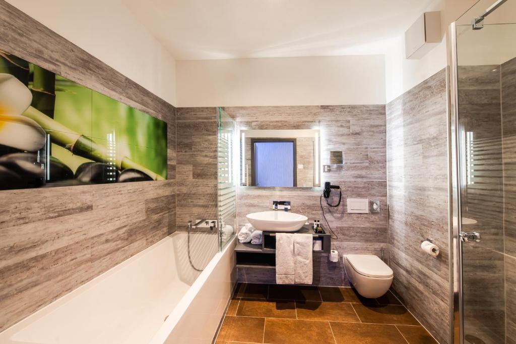 Koupelna v ubytování premium by GS Hotel