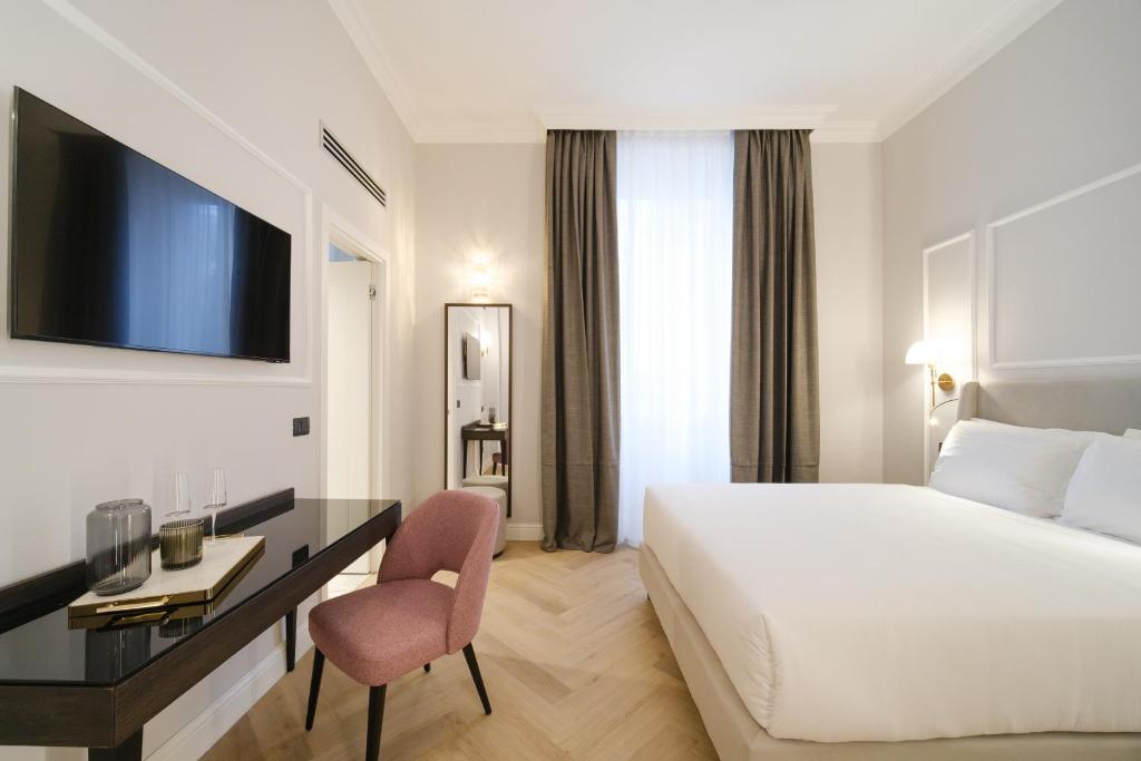 Postel nebo postele na pokoji v ubytování BH Hotel