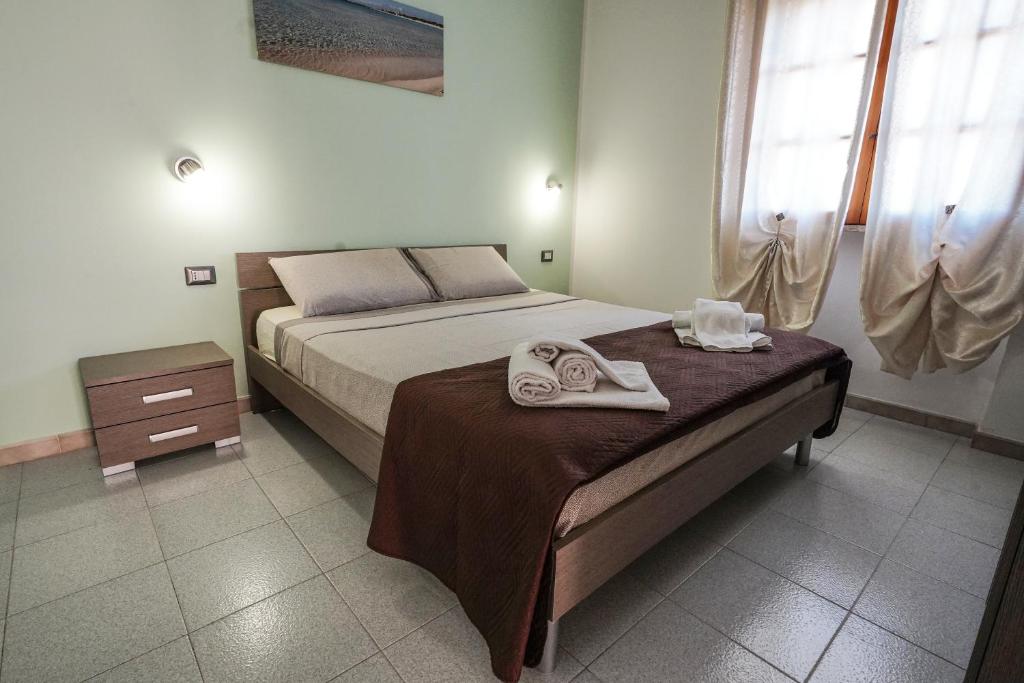 Posteľ alebo postele v izbe v ubytovaní Silvia Casa Vacanze