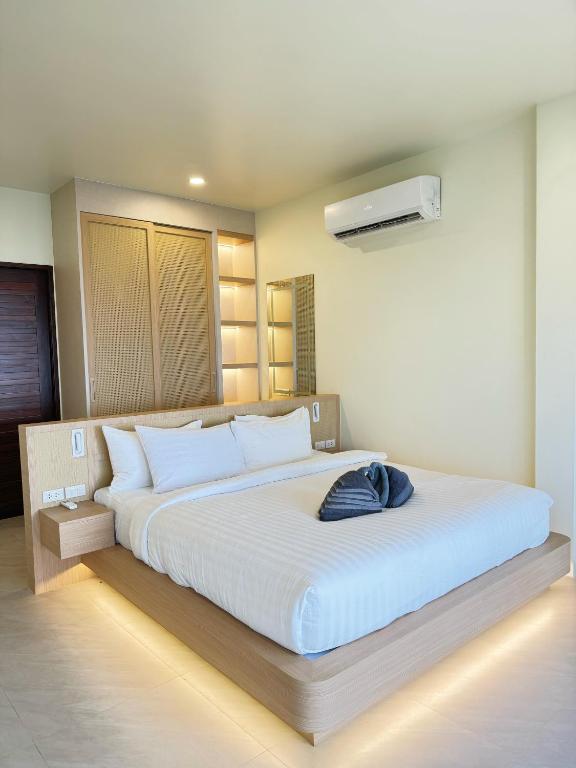 Ein Bett oder Betten in einem Zimmer der Unterkunft High Life Villas