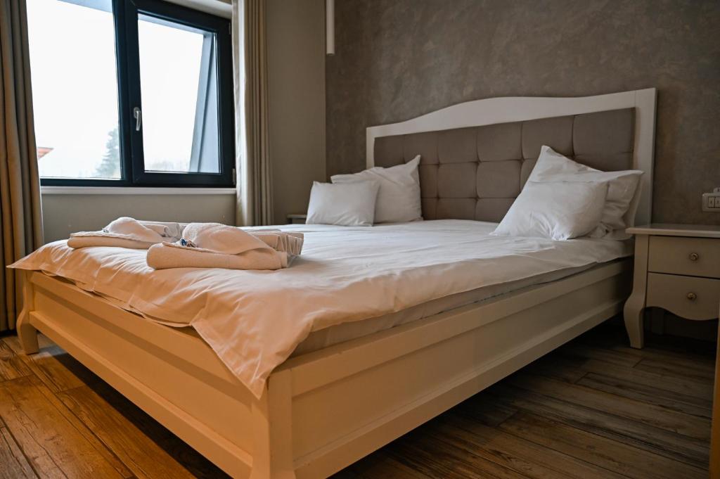 Postel nebo postele na pokoji v ubytování Camere de Inchiriat IGLOO