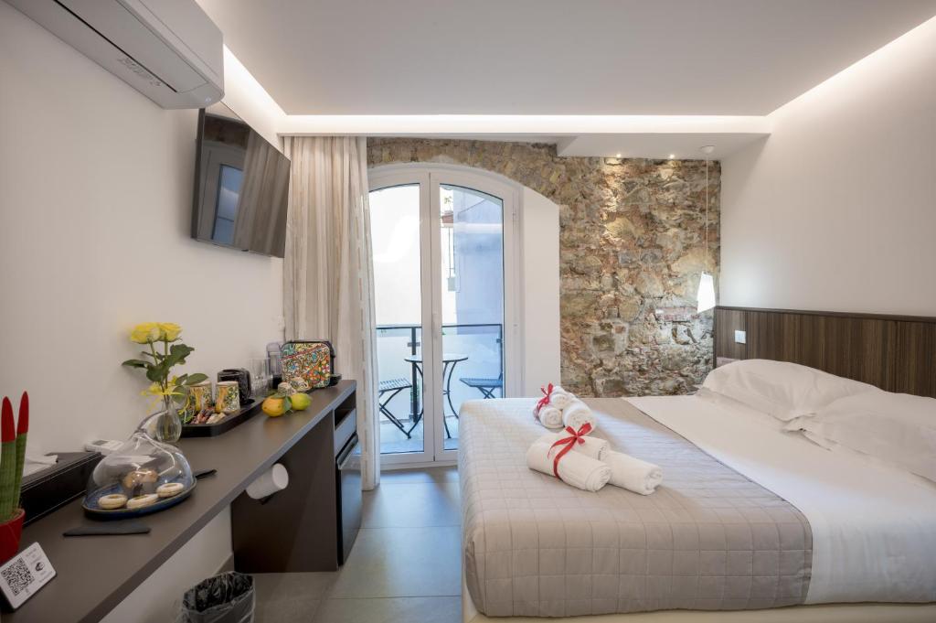 Voodi või voodid majutusasutuse Taormina charming rooms toas